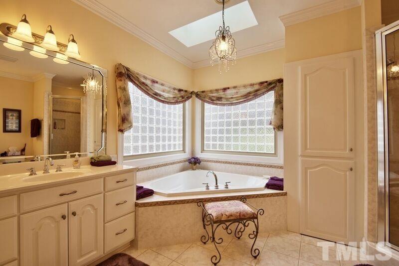 1815 Helena Moriah Road Timberlake, NC 27583 - Photo 15 of 23 a bathroom with a tub sink and mirror