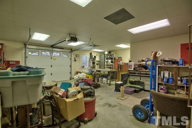 1815 Helena Moriah Road Timberlake, NC 27583 - Photo 23 of 23 a room with gym equipment and a mirror