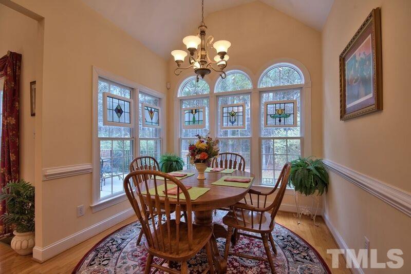 1815 Helena Moriah Road Timberlake, NC 27583 - Photo 9 of 23 a view of a dining room with furniture wooden floor and chandelier