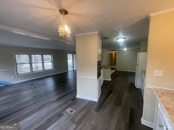 a view of hallway with wooden floor