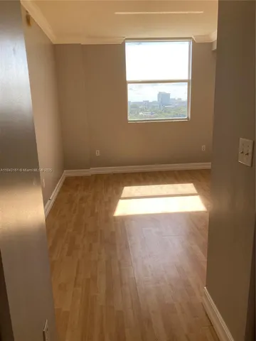 a view of an empty room and window