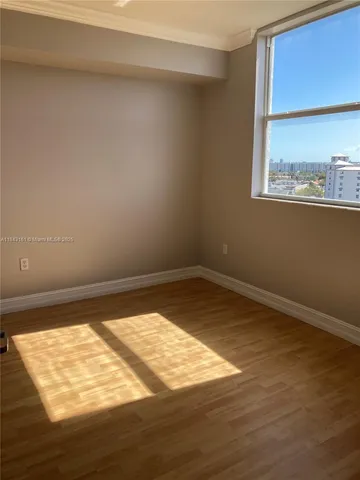 a view of an empty room and window
