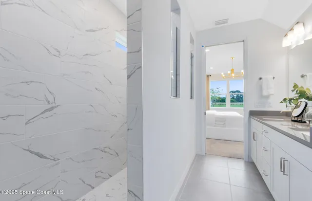 a bathroom with a granite countertop sink a toilet and shower