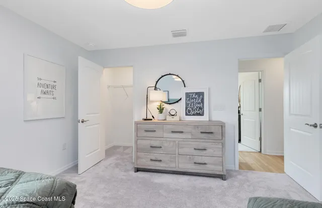 a view of room with cabinet and mirror