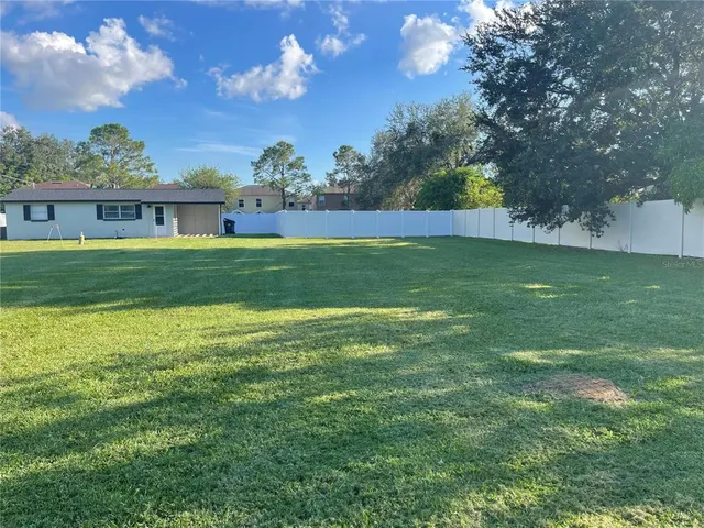a view of a backyard with a garden