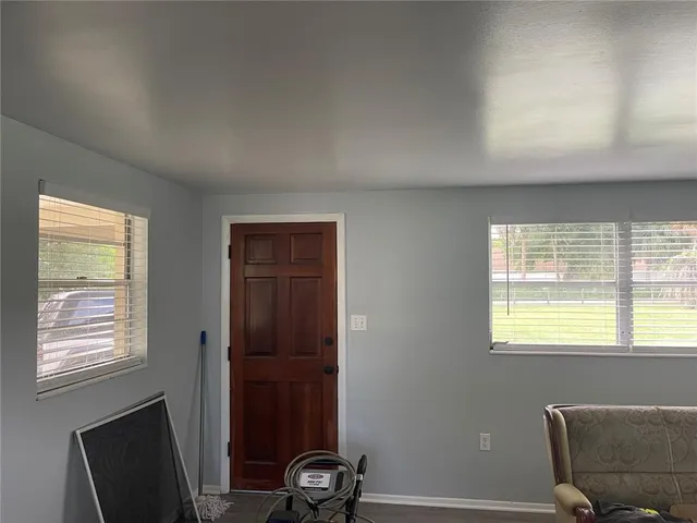 a view of a livingroom with furniture and a window