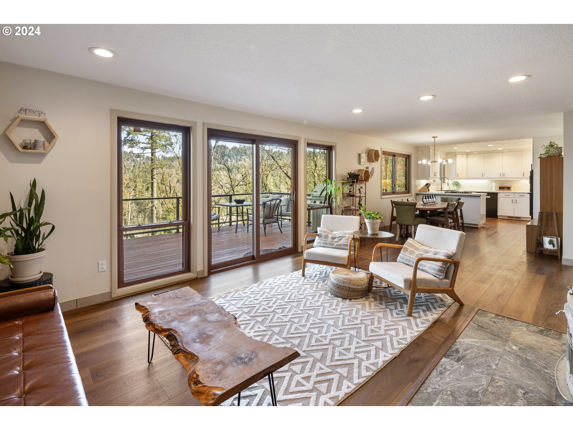 4335 Southwest Cullen Boulevard Portland, OR 97221 - Photo 14 of 46 a living room with furniture floor to ceiling window and wooden floor
