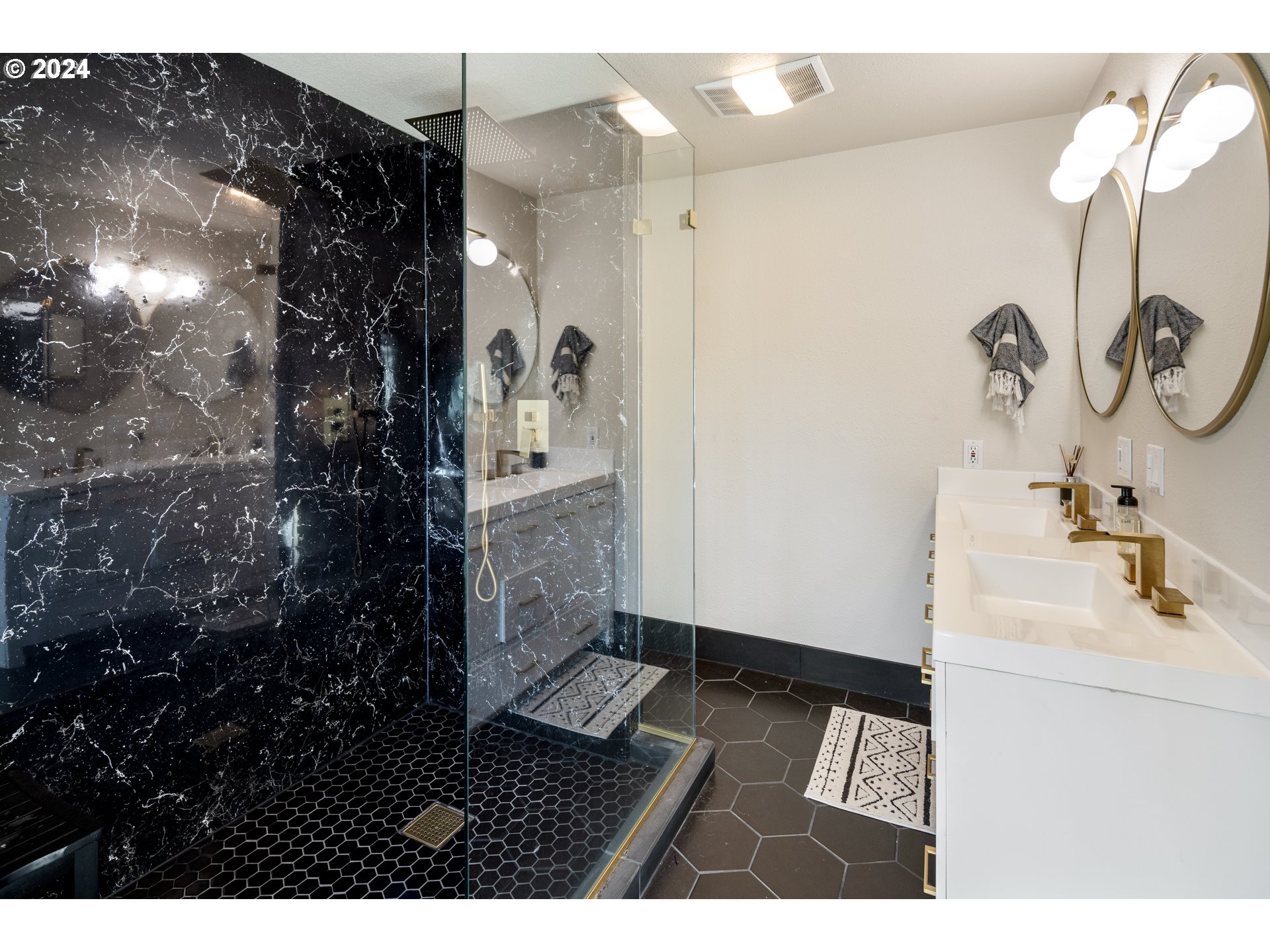 4335 Southwest Cullen Boulevard Portland, OR 97221 - Photo 18 of 46 a bathroom with a sink and a mirror