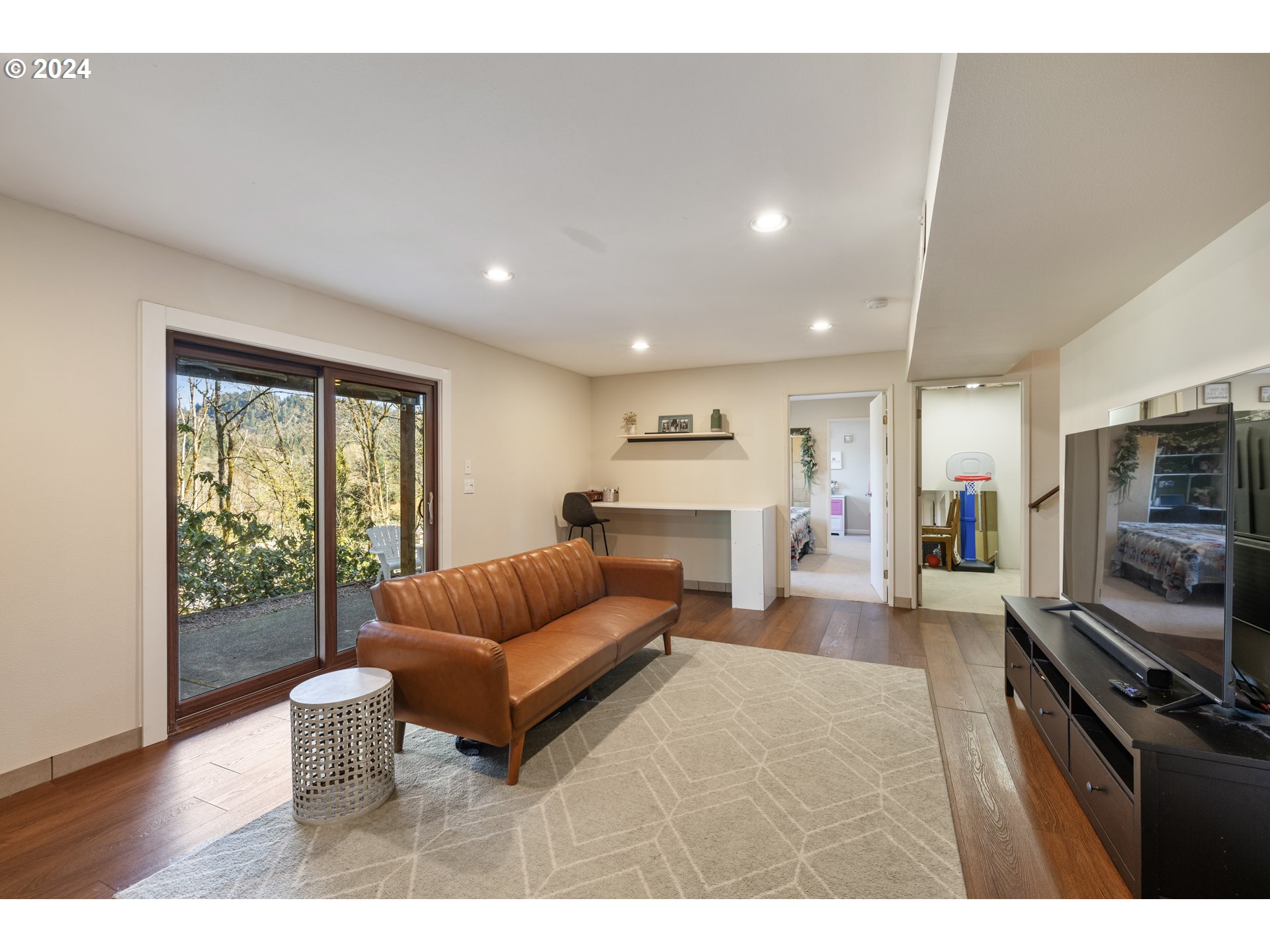 4335 Southwest Cullen Boulevard Portland, OR 97221 - Photo 26 of 46 a living room with furniture and a flat screen tv