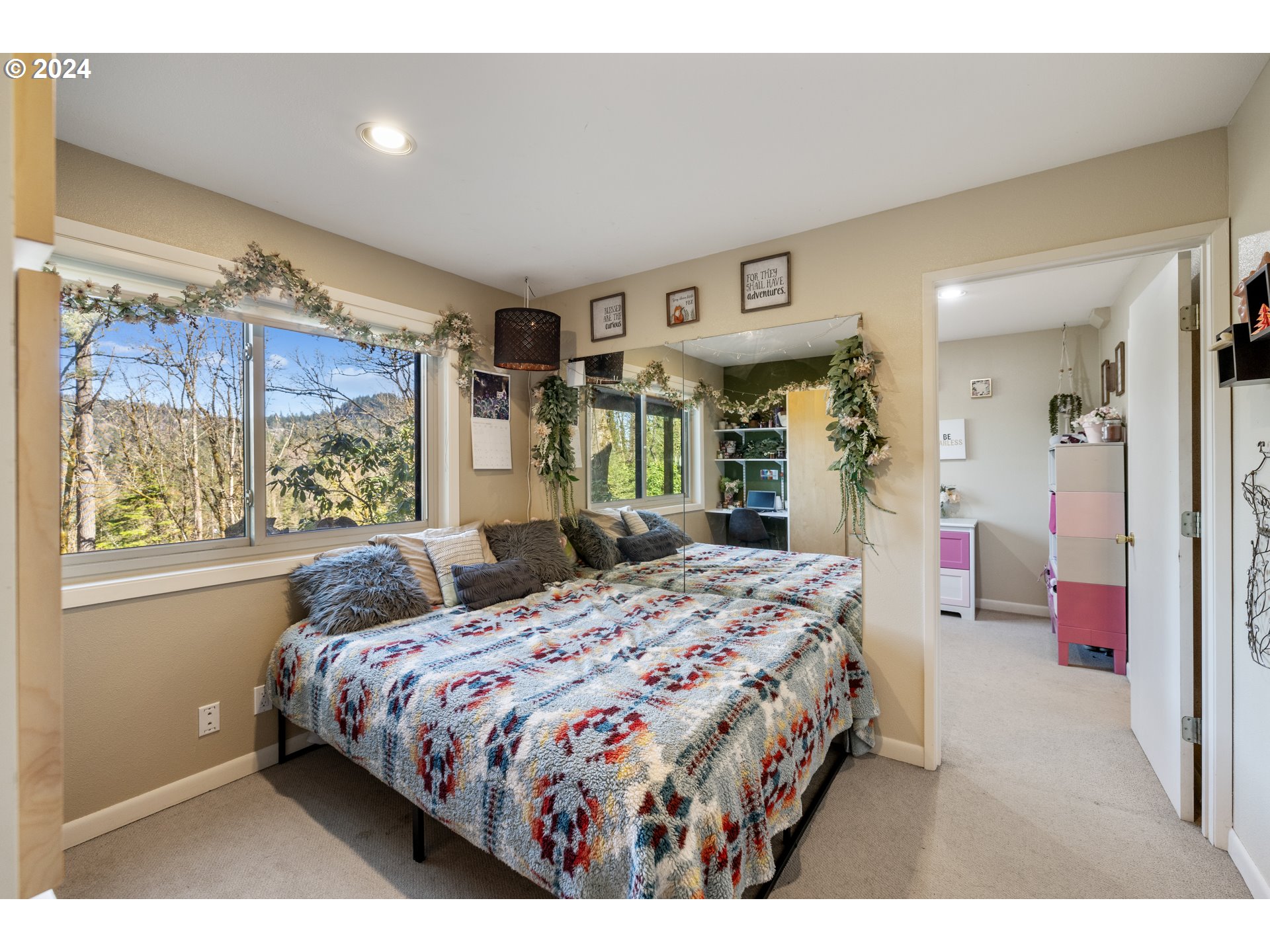4335 Southwest Cullen Boulevard Portland, OR 97221 - Photo 27 of 46 a bedroom with a large bed and a window