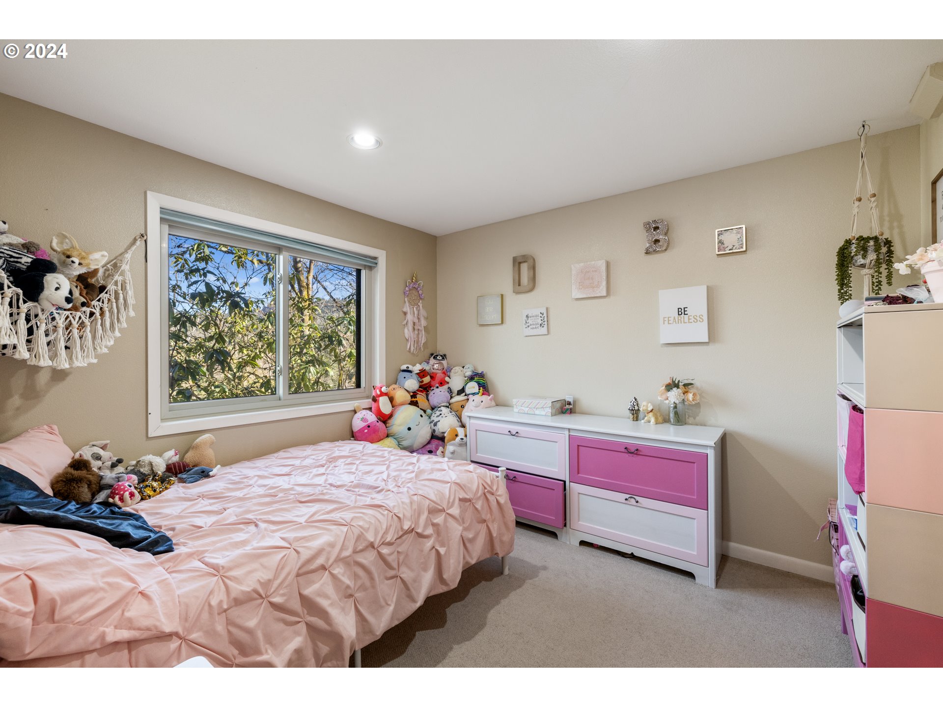 4335 Southwest Cullen Boulevard Portland, OR 97221 - Photo 28 of 46 a bedroom with a bed dresser and window
