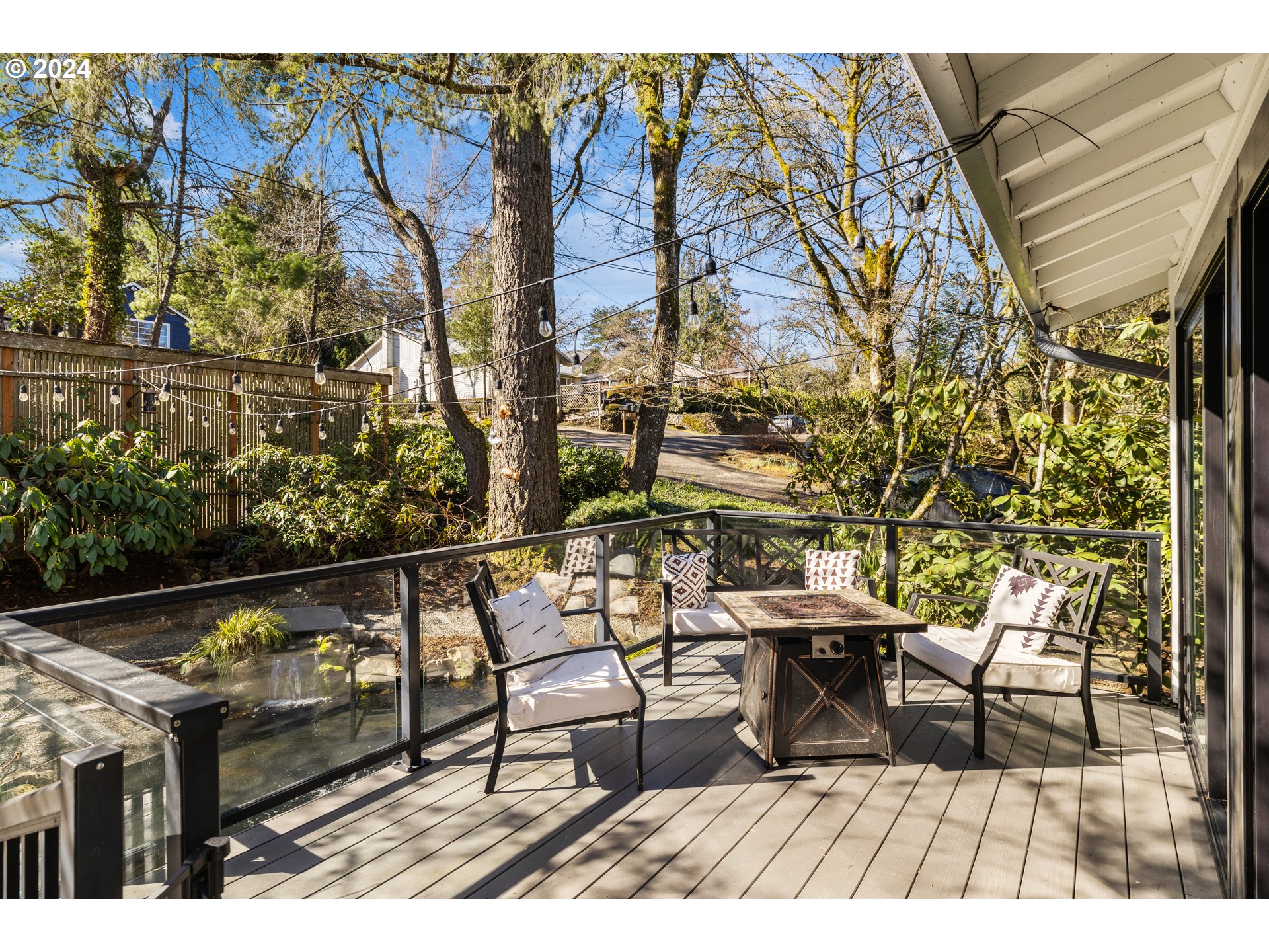 4335 Southwest Cullen Boulevard Portland, OR 97221 - Photo 38 of 46 a roof deck with chairs and wooden floor