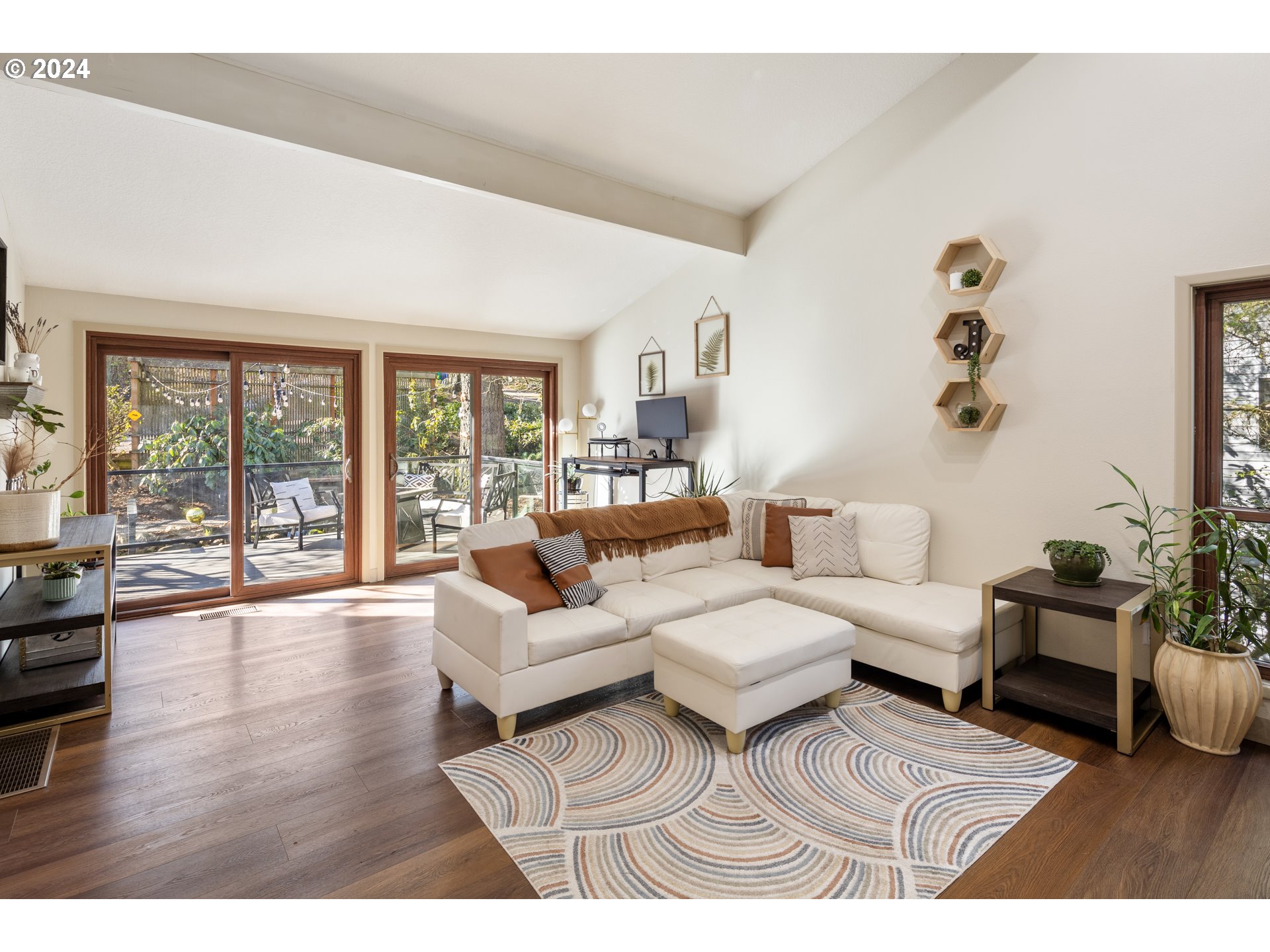 4335 Southwest Cullen Boulevard Portland, OR 97221 - Photo 4 of 46 a living room with furniture large wooden floor and a large window