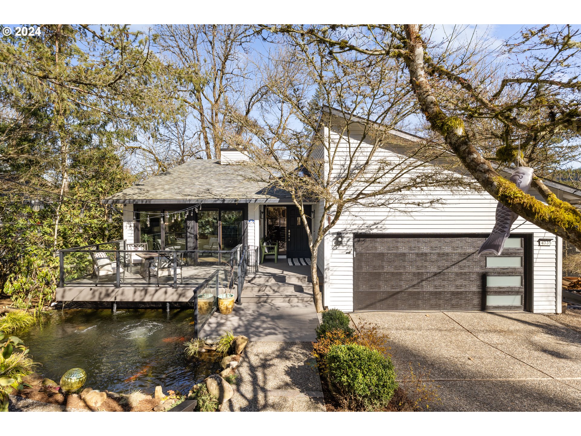 4335 Southwest Cullen Boulevard Portland, OR 97221 - Photo 46 of 46 a front view of a house with a garden