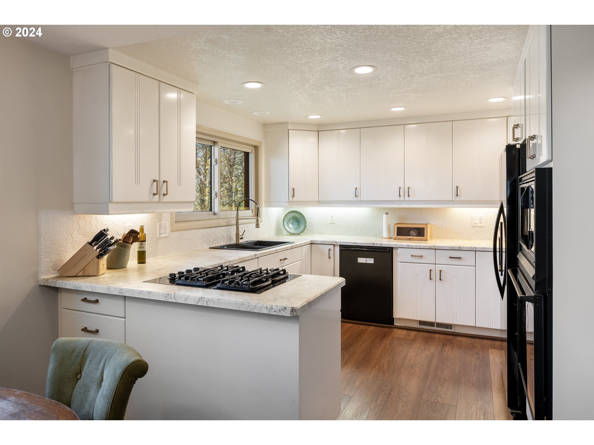 4335 Southwest Cullen Boulevard Portland, OR 97221 - Photo 9 of 46 a kitchen with a stove a sink and a refrigerator