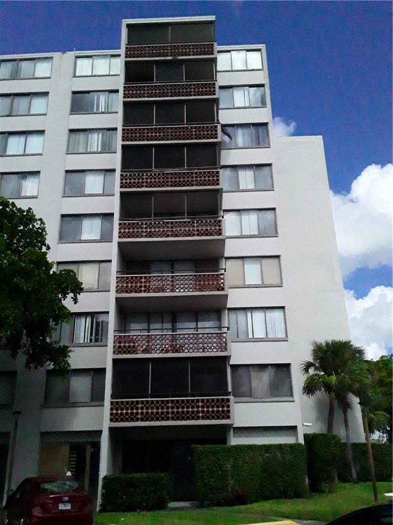 4222 Inverrary Boulevard, Unit 4610 Lauderhill, FL 33319 - Photo 1 of 32 a view of a building with many windows and a yard