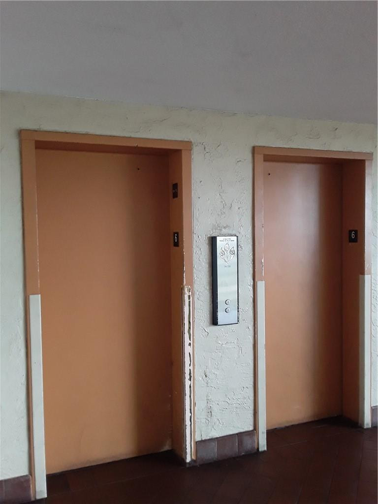 4222 Inverrary Boulevard, Unit 4610 Lauderhill, FL 33319 - Photo 22 of 32 a view of a hallway with wooden floor