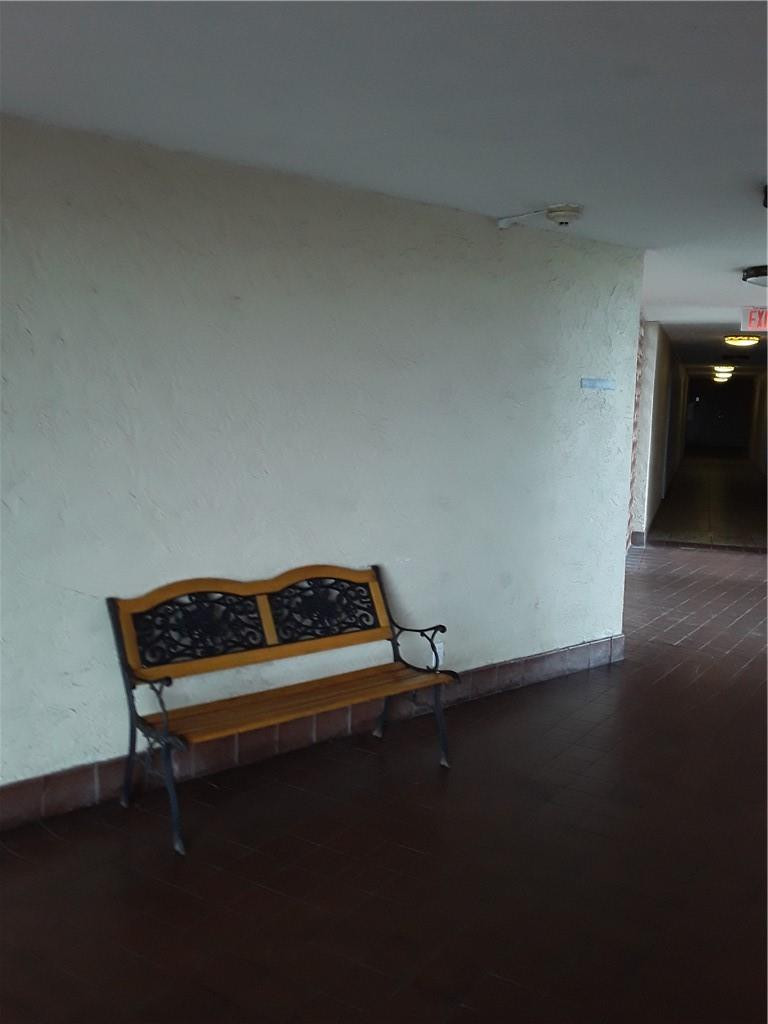 4222 Inverrary Boulevard, Unit 4610 Lauderhill, FL 33319 - Photo 24 of 32 a small space with a bench