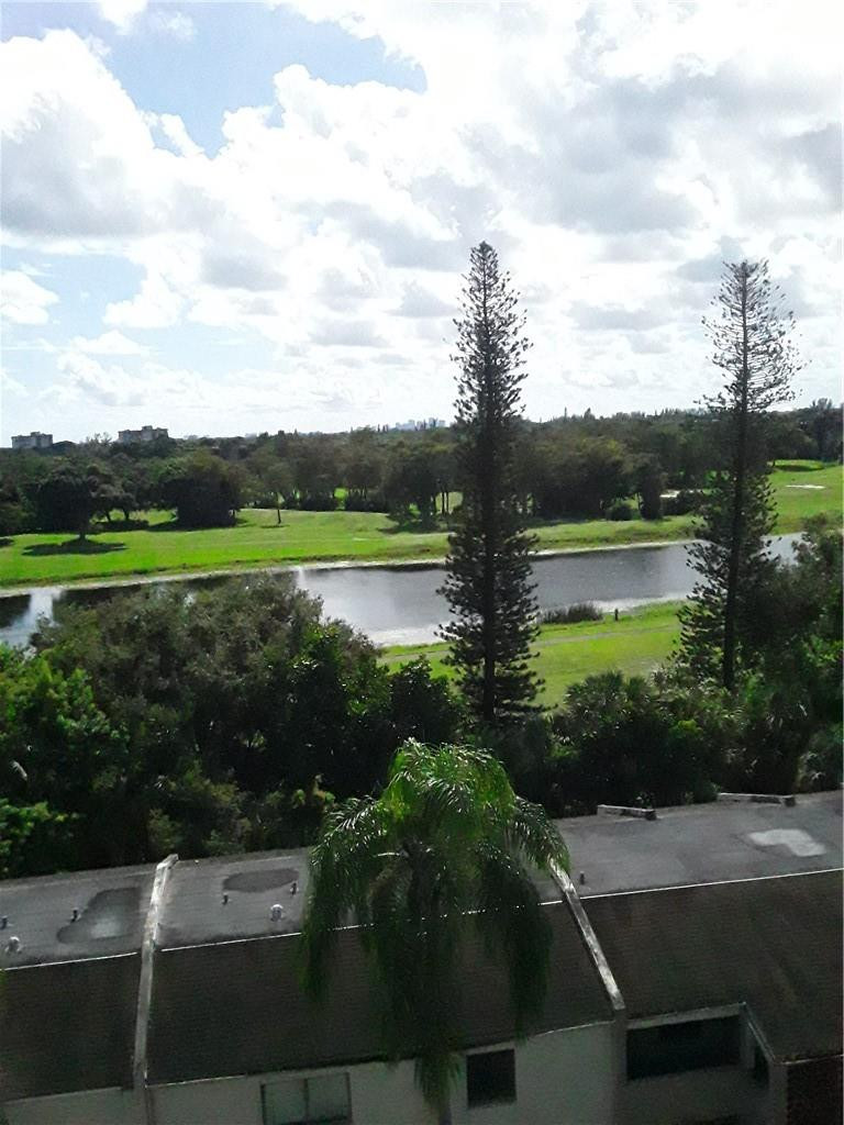 4222 Inverrary Boulevard, Unit 4610 Lauderhill, FL 33319 - Photo 29 of 32 a view of lake with green space