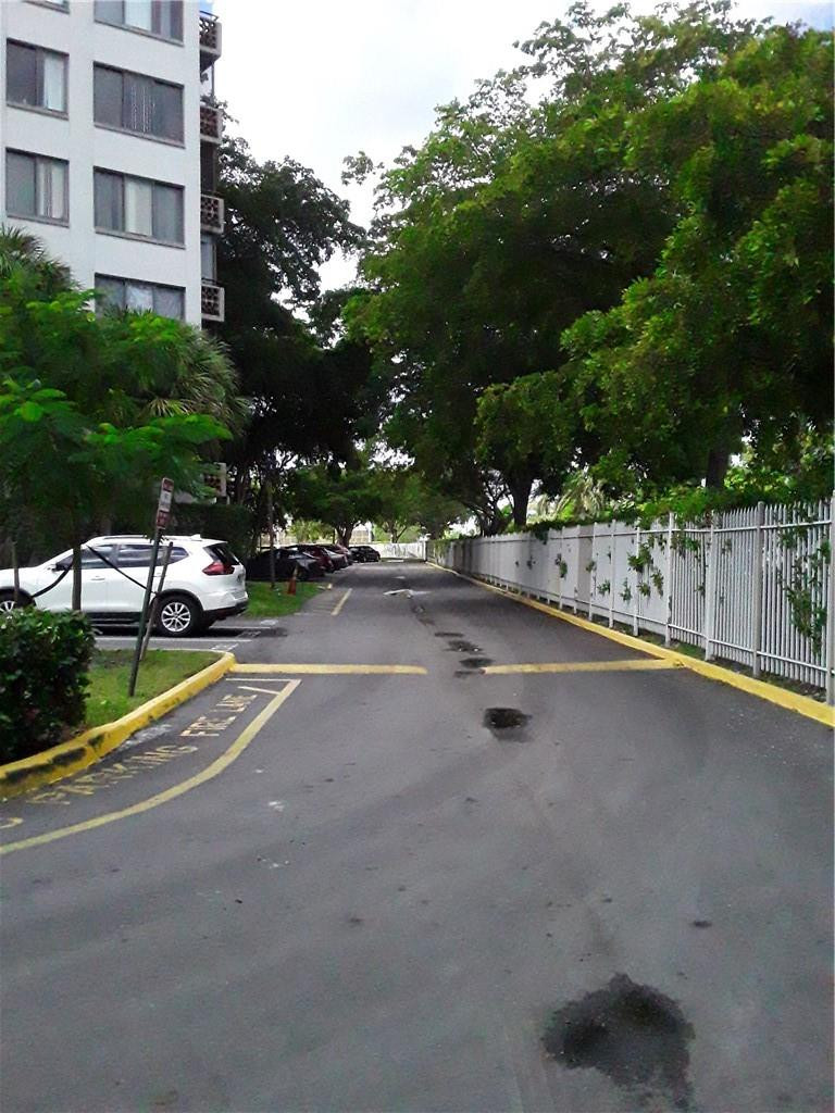 4222 Inverrary Boulevard, Unit 4610 Lauderhill, FL 33319 - Photo 30 of 32 a view of a street with houses