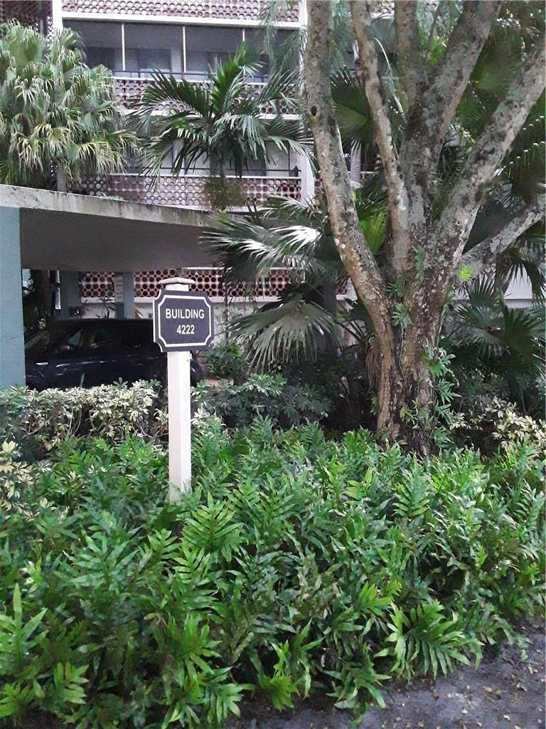 4222 Inverrary Boulevard, Unit 4610 Lauderhill, FL 33319 - Photo 4 of 32 a view of a street with flower plants