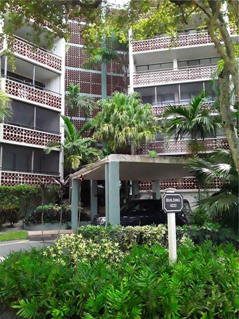4222 Inverrary Boulevard, Unit 4610 Lauderhill, FL 33319 - Photo 5 of 32 a view of a house with a yard and plants