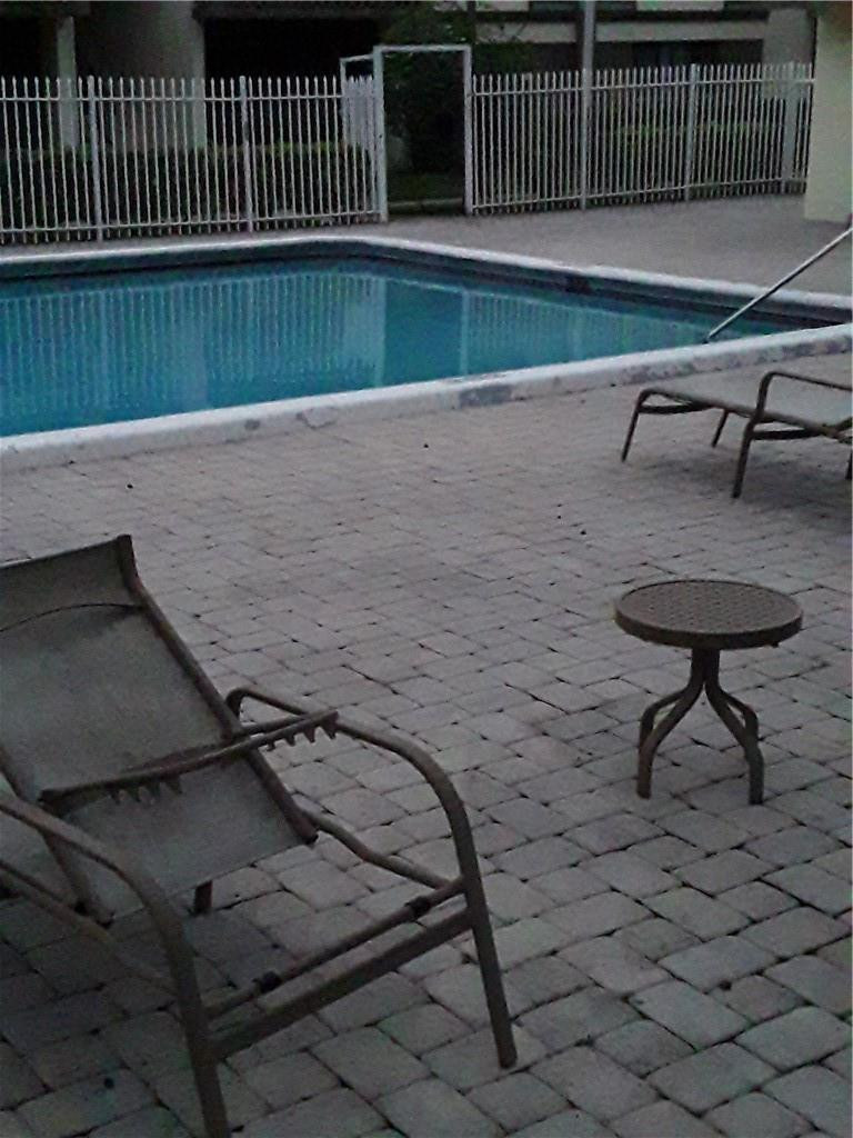 4222 Inverrary Boulevard, Unit 4610 Lauderhill, FL 33319 - Photo 7 of 32 a view of outdoor space with wooden deck