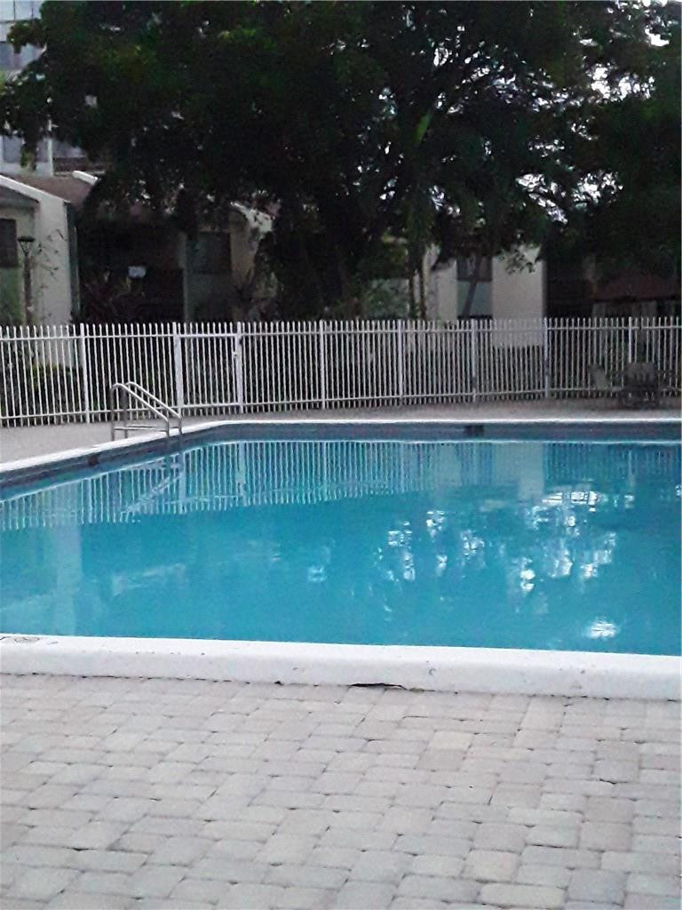 4222 Inverrary Boulevard, Unit 4610 Lauderhill, FL 33319 - Photo 8 of 32 a view of swimming pool and a patio
