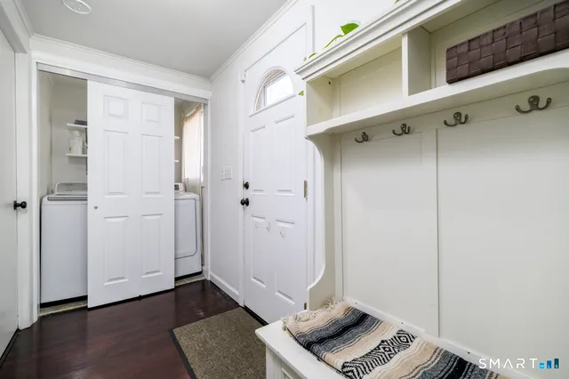 a view of room with hardwood floor and sink