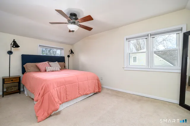 a bedroom with a bed and window