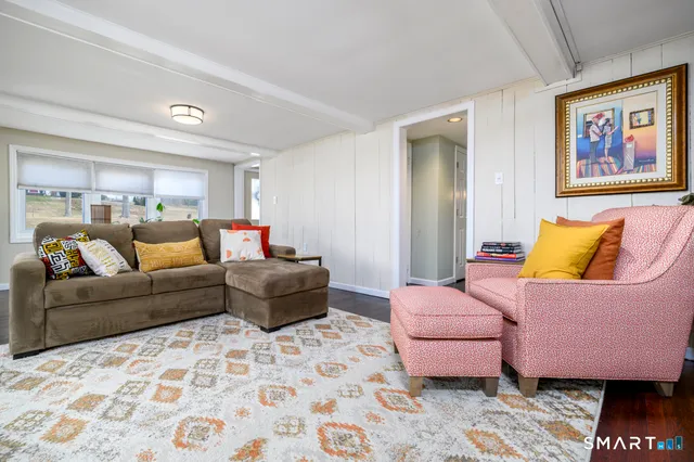 a living room with furniture and a rug