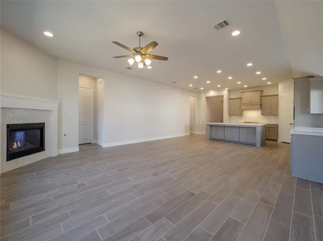 a view of a livingroom with a kitchen