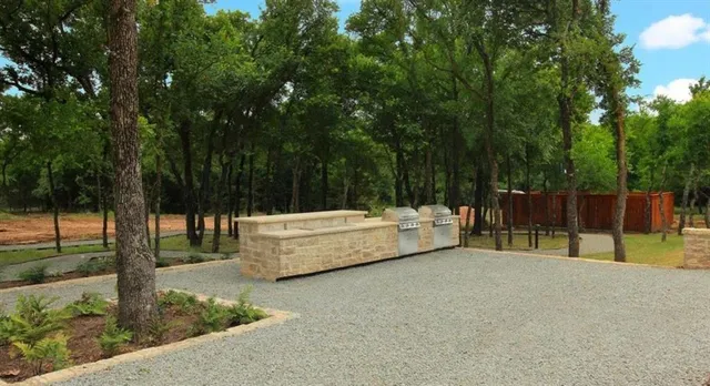 a view of a backyard with swimming pool