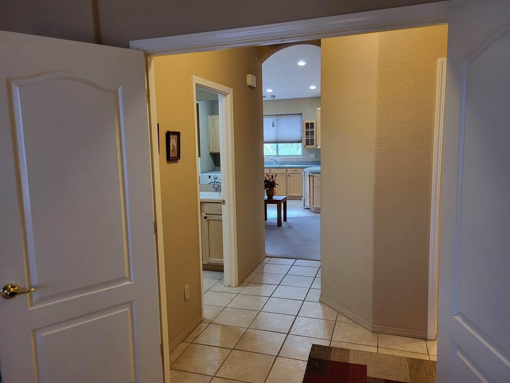 1120 South Sycamore Circle Payson, AZ 85541 - Photo 29 of 44 a view of a hallway with wooden floor and a bathroom