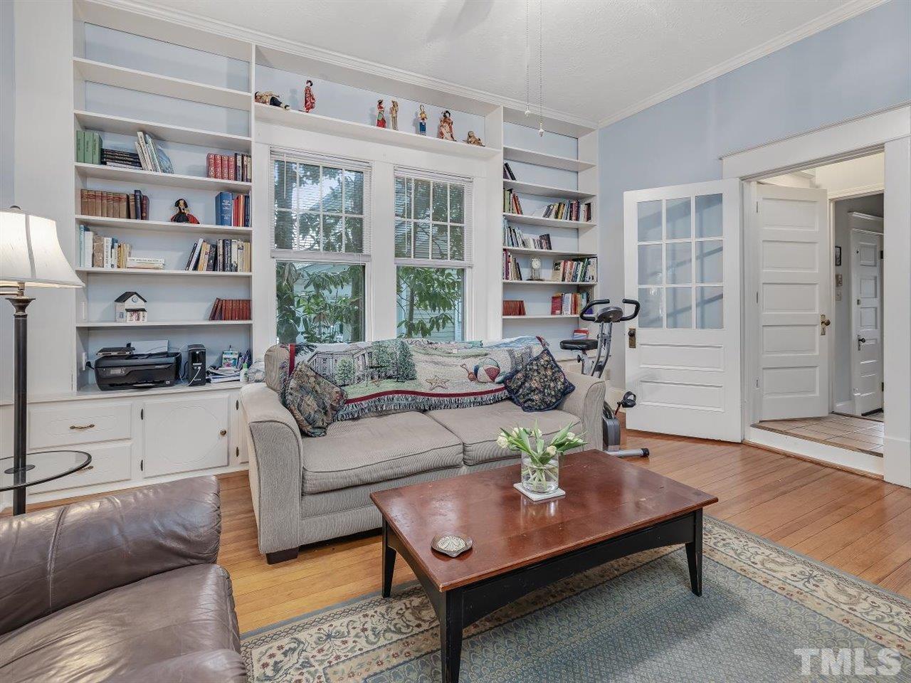 216 Hillcrest Road Raleigh, NC 27605 - Photo 14 of 49 a living room with furniture a table and a large window
