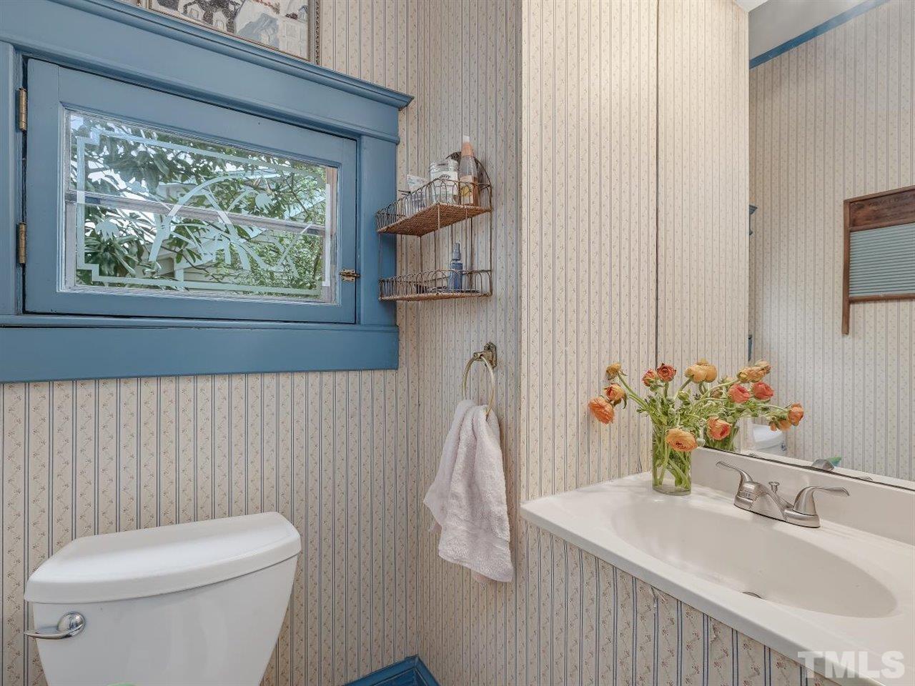 216 Hillcrest Road Raleigh, NC 27605 - Photo 15 of 49 a bathroom with a sink a toilet and tub