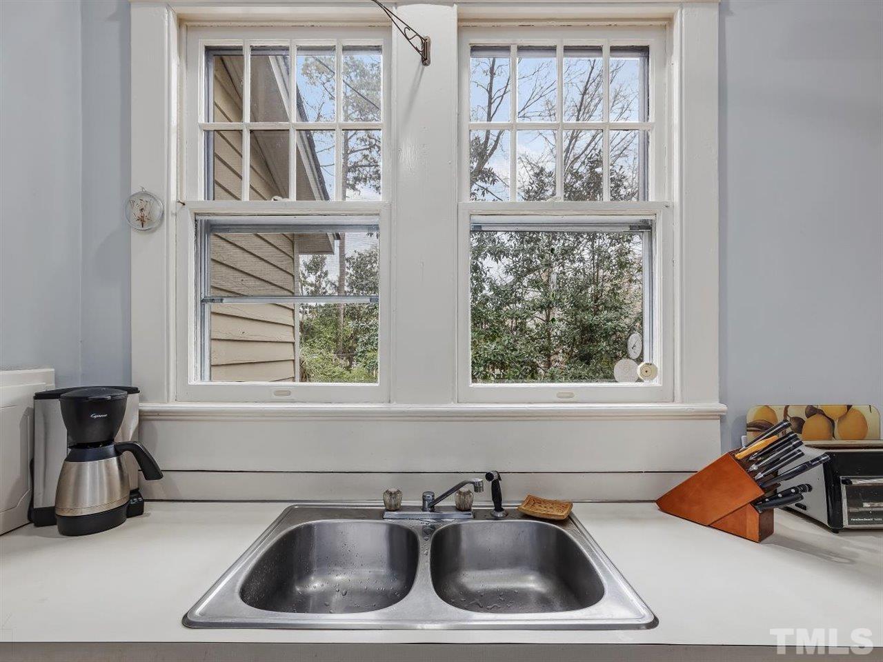 216 Hillcrest Road Raleigh, NC 27605 - Photo 18 of 49 a kitchen with a sink and a window
