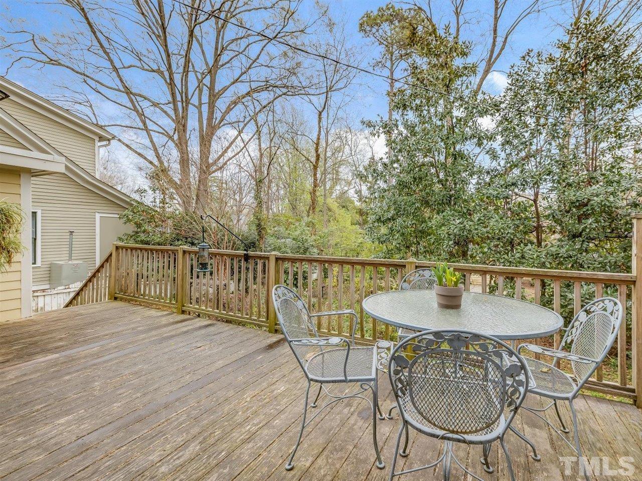 216 Hillcrest Road Raleigh, NC 27605 - Photo 21 of 49 a balcony with table and chairs