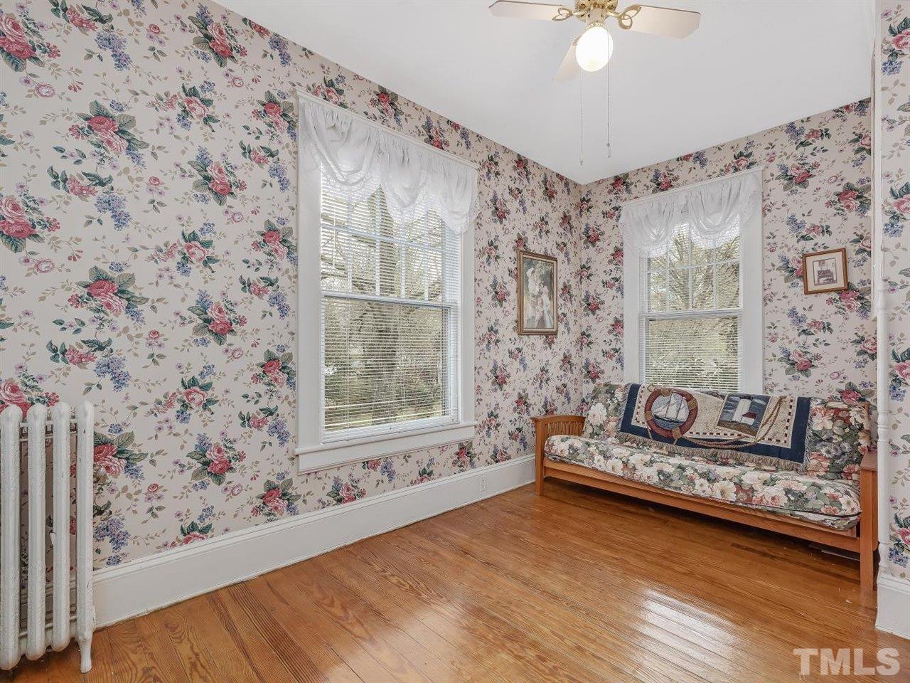216 Hillcrest Road Raleigh, NC 27605 - Photo 30 of 49 a living room with furniture and a floor to ceiling window