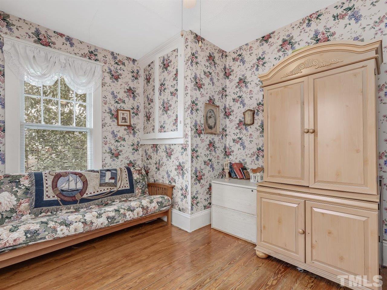216 Hillcrest Road Raleigh, NC 27605 - Photo 31 of 49 a view of a livingroom with wooden floor and furniture