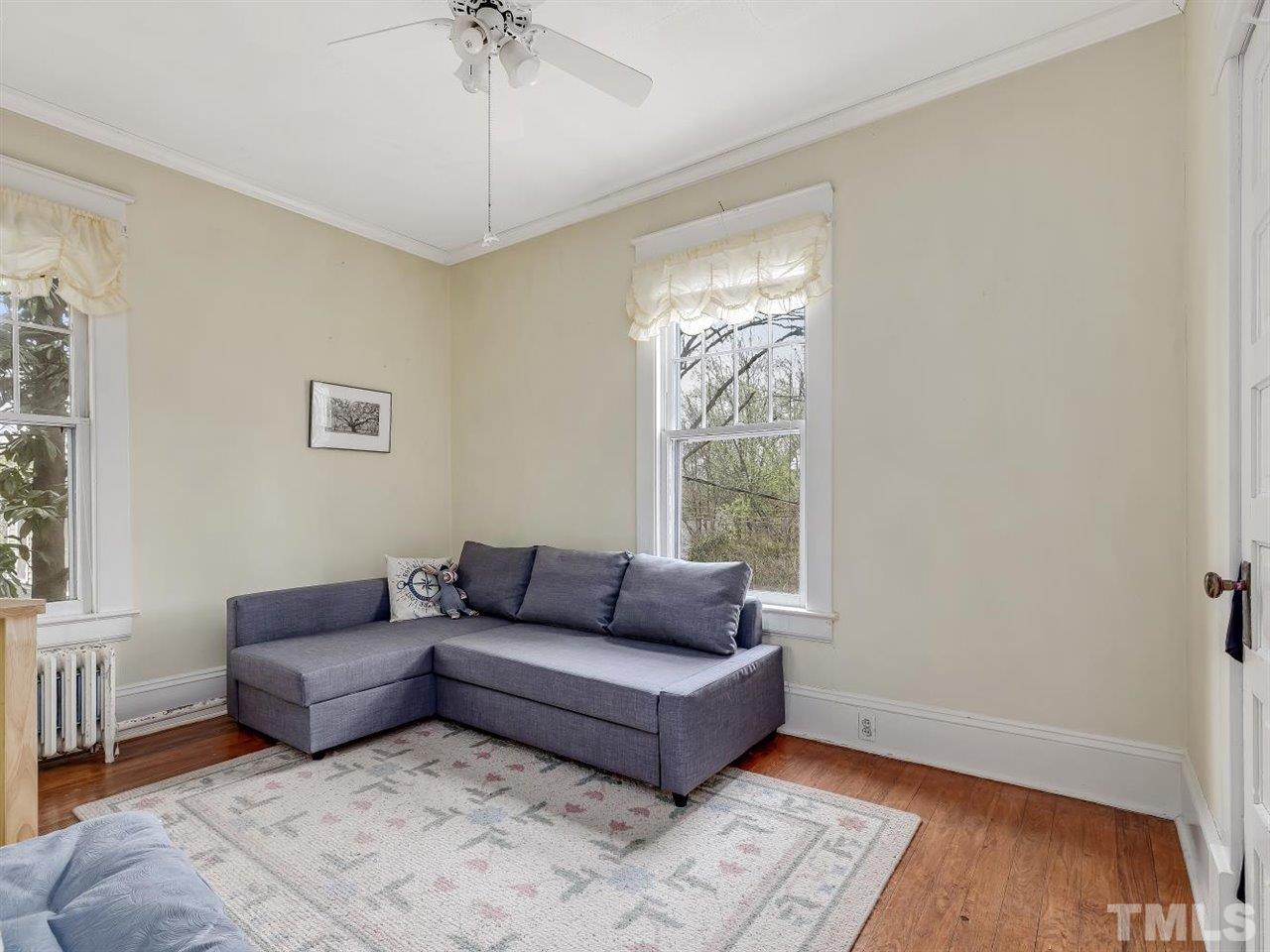 216 Hillcrest Road Raleigh, NC 27605 - Photo 34 of 49 a living room with furniture and a window