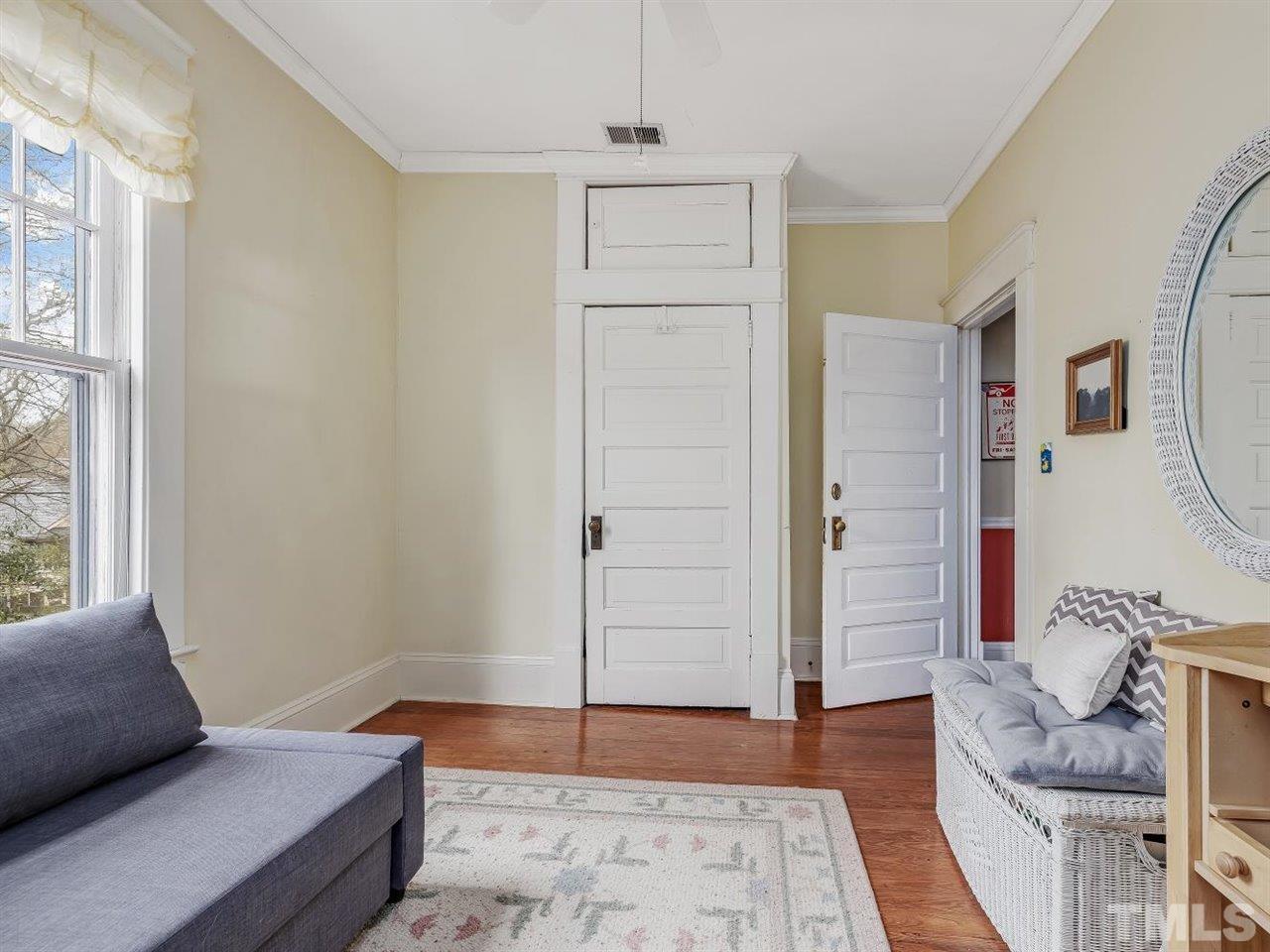 216 Hillcrest Road Raleigh, NC 27605 - Photo 35 of 49 a living room with furniture and a rug