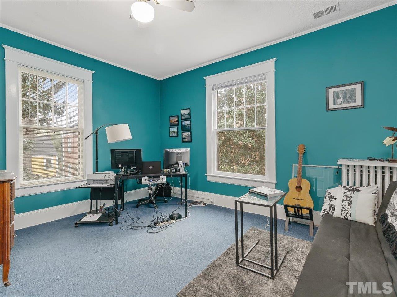 216 Hillcrest Road Raleigh, NC 27605 - Photo 36 of 49 a living room with furniture and a large window