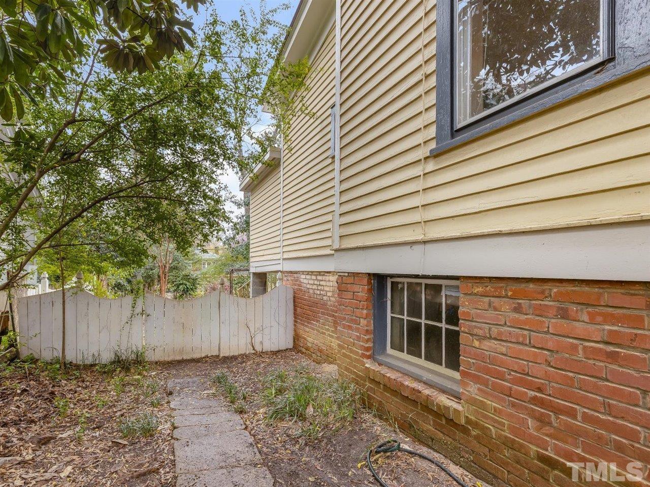 216 Hillcrest Road Raleigh, NC 27605 - Photo 39 of 49 a view of a house with a backyard