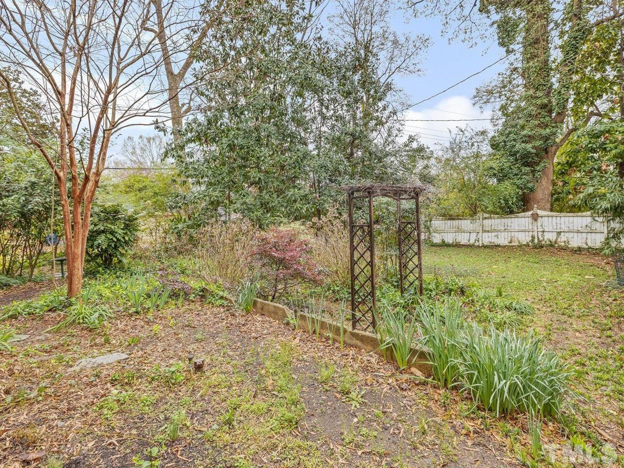 216 Hillcrest Road Raleigh, NC 27605 - Photo 41 of 49 a view of a lake with a house