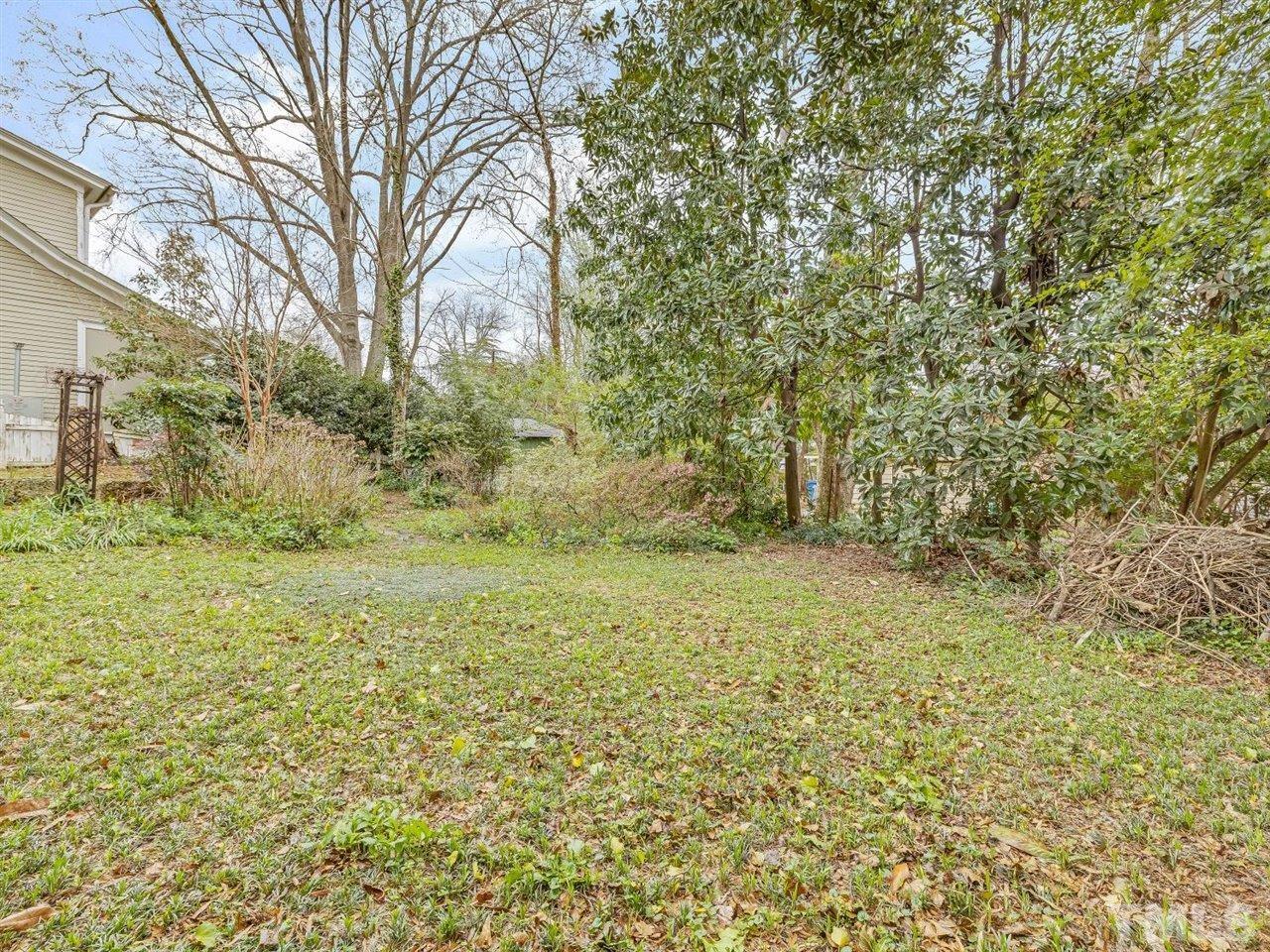 216 Hillcrest Road Raleigh, NC 27605 - Photo 44 of 49 a view of outdoor space and a yard