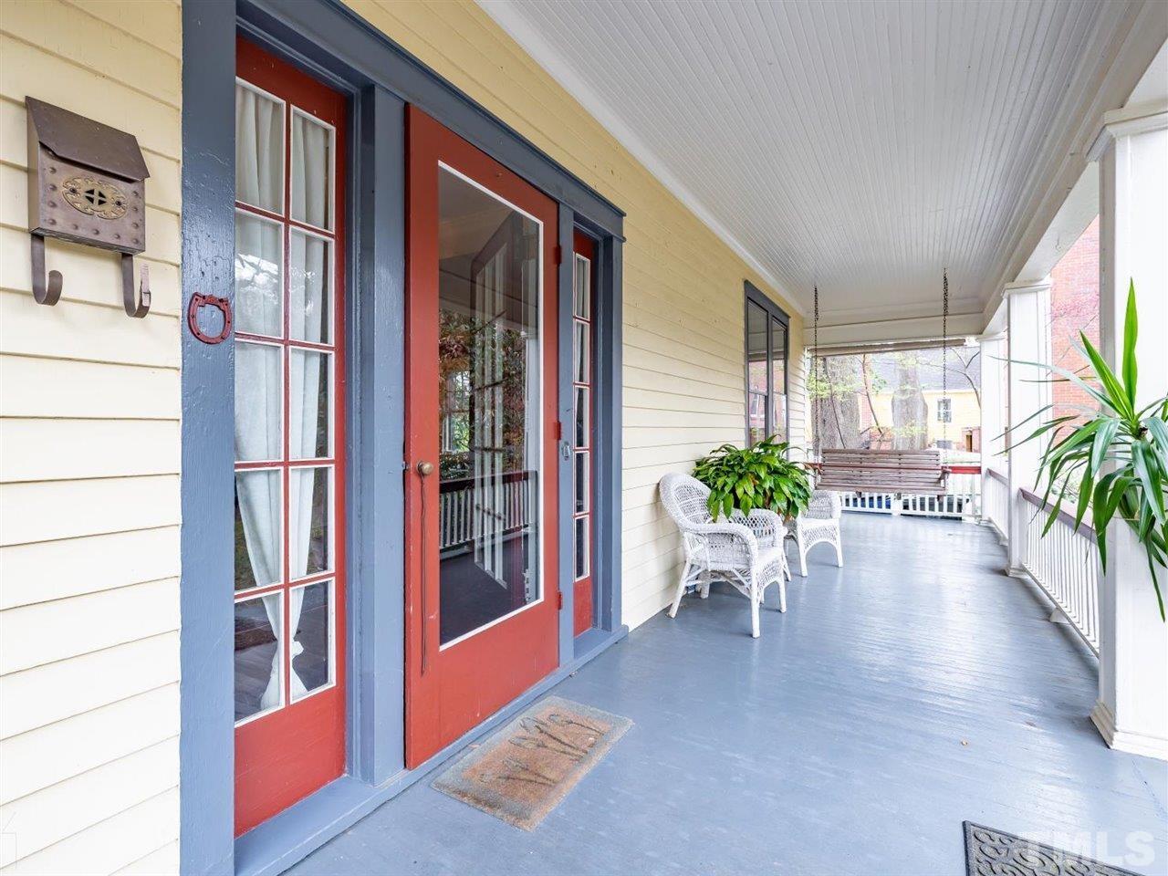 216 Hillcrest Road Raleigh, NC 27605 - Photo 5 of 49 a view of a balcony with potted plants