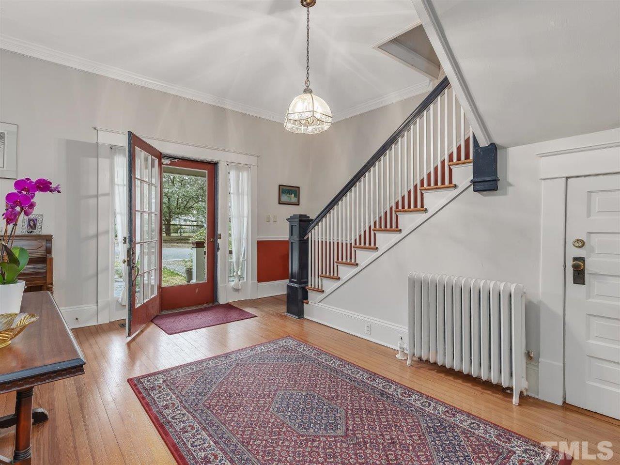 216 Hillcrest Road Raleigh, NC 27605 - Photo 8 of 49 a view of entryway and hall with wooden floor