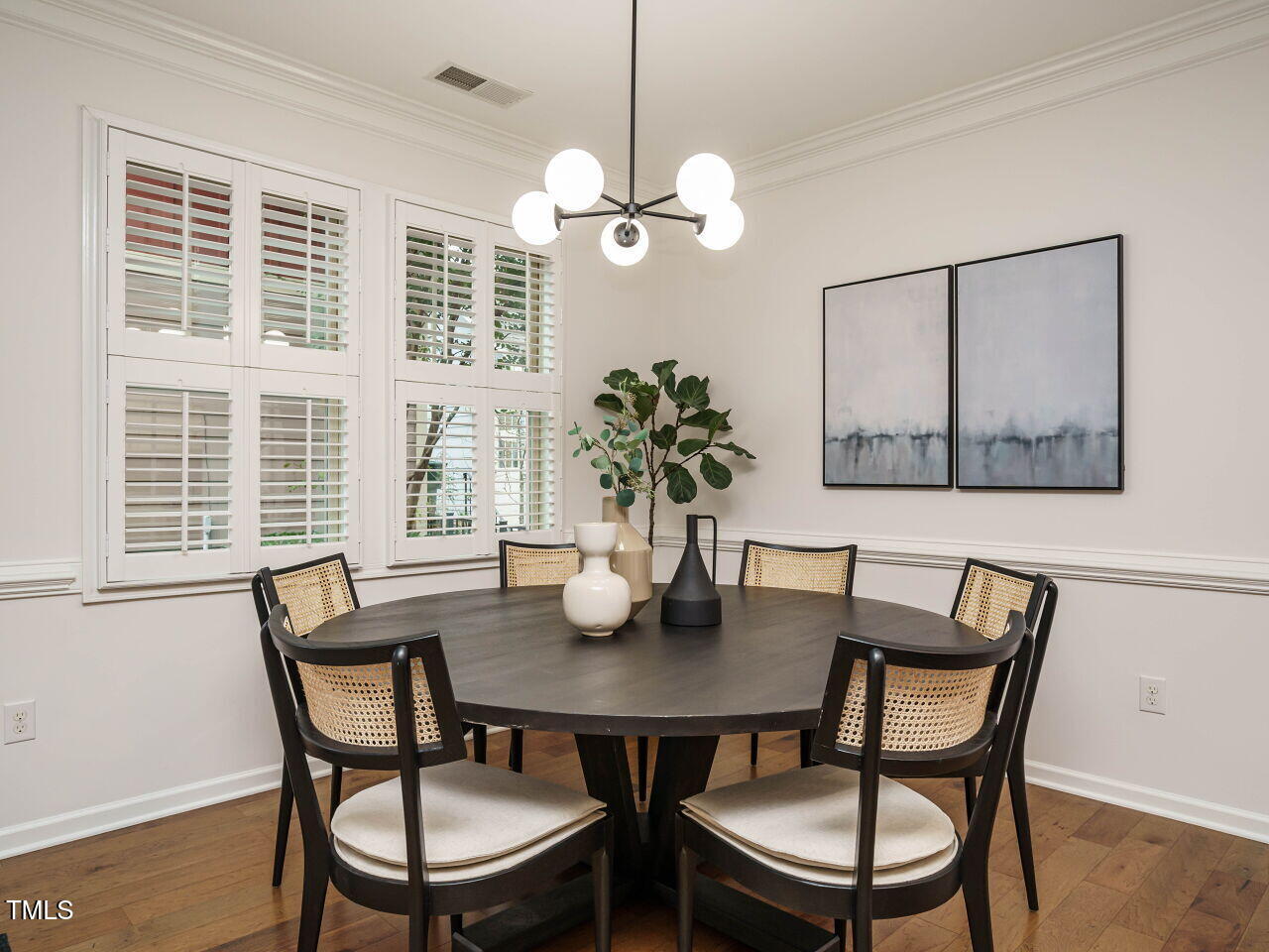 5514 Wade Park Boulevard Raleigh, NC 27607 - Photo 11 of 31 a view of a dining room with furniture window and wooden floor