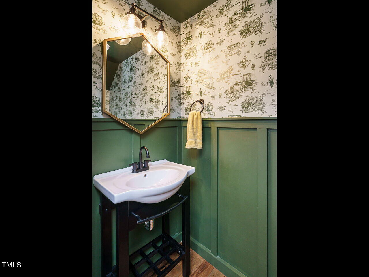 5514 Wade Park Boulevard Raleigh, NC 27607 - Photo 21 of 31 a bathroom with a sink and a mirror
